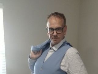 Freckledandtattooed profielfoto van cam model